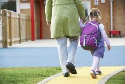 parent walking school- age child to/from school