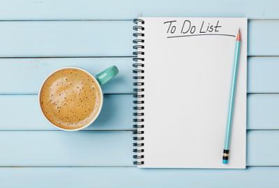 image shows a to-do list and cup of coffee